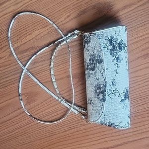 Patent leather black and white handbag